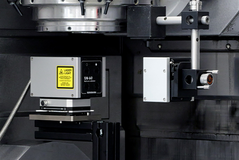 Calibre multiaxe XM-60 utilisé pour effectuer un test sur une machine